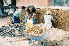 Working with homeowners to prepare adobe walls for lime plaster in Mesilla, New Mexico